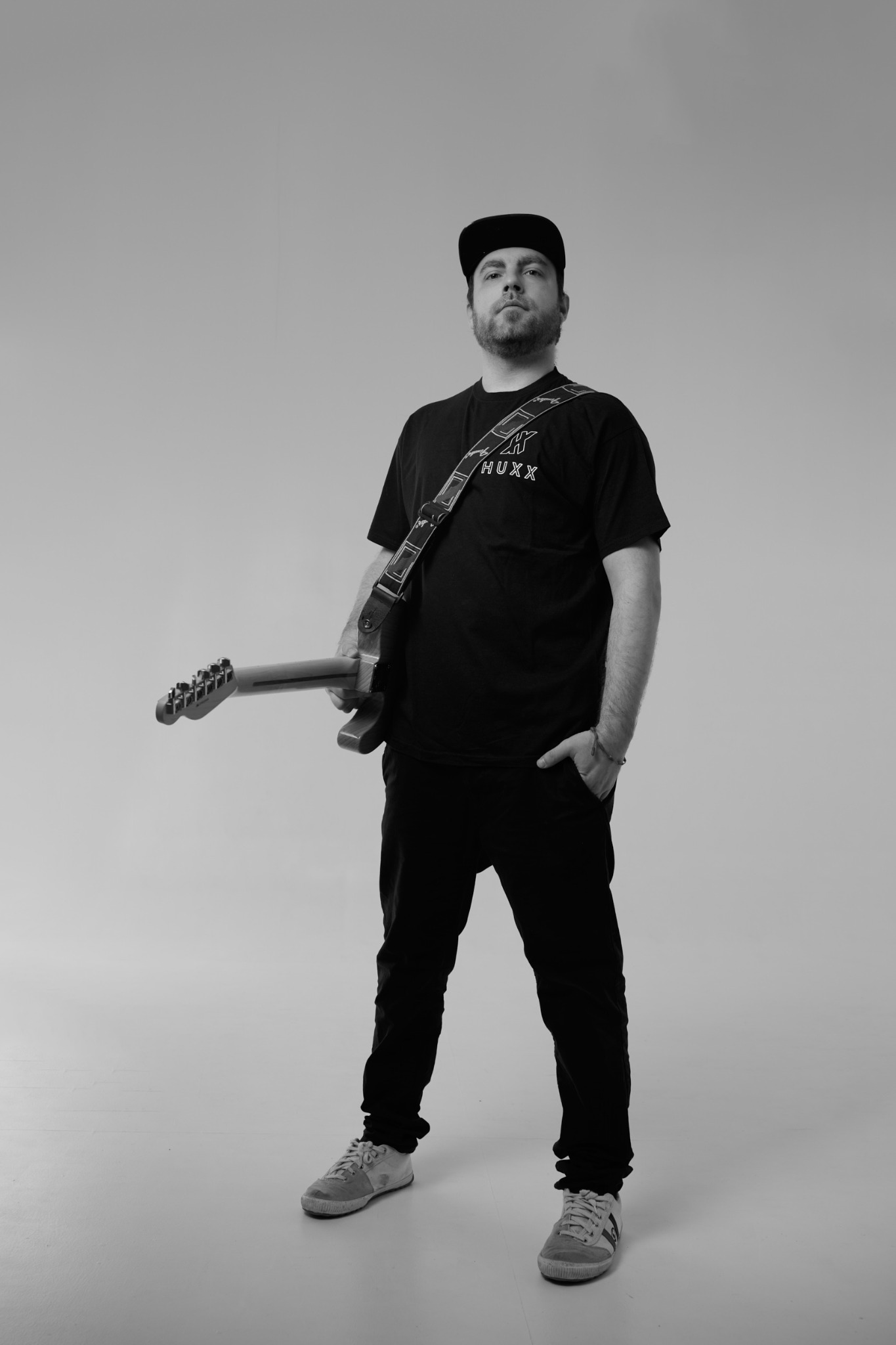 Official photo of HUXX with guitar